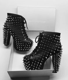 Black Spiked Platform Boots For Concert, Gothic Black Boots With Spikes, Fall Black Lace-up Boots With Rivets, Party Lace-up Platform Heeled Boots, Black Spiked Winter Platform Boots, Gothic Lace-up Boots For Fall Party, Gothic Black Heels For Party, Black Punk High Heels, Edgy Lace-up Boots With Round Toe For Night Out