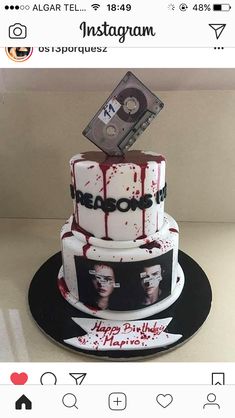 a three tiered cake with the words reason on it and an audio tape sticking out of top