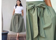 Make this gorgeous green poplin skirt your confidante to seize the day stylishly! Wear it as an everyday wear, a travel wear, a work wear, an office wear, a summer or fall skirt, a vacation wear, and even a holiday wear. The olive green midi skirt with wide belt is great for many different seasons and occasions. This is a safari skirt for women and teen girls. Made with a lush cotton poplin fabric, the olive skirt comes with an A-line silhouette, a smock waist, a wide hem, pleats, two pockets, and a detachable belt in matching color.  It is a small skirt to plus size skirt: ~~ modest mid calf length: 80 cm / 31.5 in (Want a custom length skirt? Message us!) ~~ elastic waist band fits comfortably from 66 to 102 cm / 26 to 40 in This khaki skirt is modeled by a 1.65 m tall woman Easy Care Th Olive Green Midi Skirt, Safari Skirt, Green Skirt Outfits, Army Green Skirt, Skirt Outfit Summer, Modest Casual, Olive Green Skirt, Green Midi Skirt, Bridesmaid Skirts