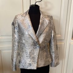 Purchased This From A Local Trunk Show - I Wear A Size 4 - And This Fits Like A 6. They Didn’t Have A Smaller Size So Just Kept It - Never Worn. Nonsmoking Home. Shown On Size 4 Mannequin. Chest 19” Armpit To Armpit Sleeve 24” Length 22 1/2” Beautiful Jacket! Chic Fitted Metallic Blazer, Fitted Silver Blazer For Evening, Chic Silver Blazer For Party, Chic Fitted Silver Blazer, Chic Silver Fitted Blazer, Silver Winter Formal Blazer, Silver Formal Blazer For Winter, Spring Metallic Fitted Blazer, Metallic Fitted Blazer For Spring