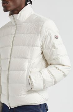 The label known for its impeccable outerwear brings forth another capsule-wardrobe essential with a streamlined puffer jacket insulated with plush down. Two-way front-zip closure Stand collar Front welt pockets Lined, with down fill 100% polyester Hand wash, line dry Imported Designer Clothing White Zip Fly Outerwear For Winter, Casual Winter White Duck Down Puffer Jacket, White Down Puffer Outerwear, Functional White Down Outerwear, Casual White Duck Down Puffer Jacket, White Down Functional Outerwear, Winter White Down Outerwear With Padded Collar, Solid Color Down Puffer Jacket With Zipper, Luxury Down Outerwear With Zipper Closure