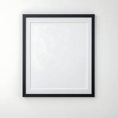 a black frame hanging on the wall with a white background and an empty space for text