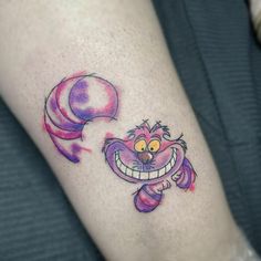 a cartoon character tattoo on the leg