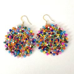 Beaded Confetti Splash Seed Bead Earrings Large Multicolored Disc Earrings by WorkofHeart on Etsy Rainbow Beaded Earrings For Beach, Multicolor Circular Beaded Earrings With Ear Wire, Fun Multicolor Beaded Drop Earrings, Multicolor Large Beaded Round Earrings, Multicolor Beaded Circle Earrings, Colorful Large Beaded Earrings, Fun Multicolor Round Beaded Earrings, Multicolor Round Beaded Earrings, Fun Colorful Beaded Round Earrings