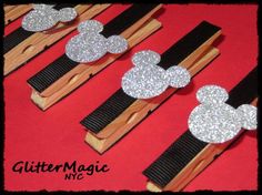 mickey mouse hair clips with glittery ears and black ribbon on red background, set of 5