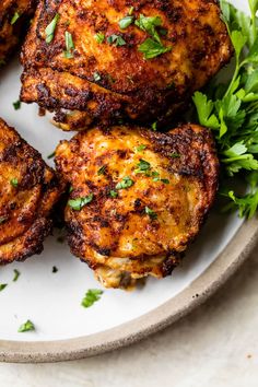 Unbelievably juicy Air Fryer Chicken Thighs with perfectly CRISPY skin! These easy chicken thighs are ready in less than 30 minutes, making them the ideal weeknight meal! A simple spice rub adds scrumptious flavor! #wellplatedrecipes #airfryerchicken #chickenthighs #airfryerchickenthighs #crispychickenthighs Easy Chicken Thighs, Well Plated, Crispy Chicken Thighs, Golden Skin, Easy Chicken Dinner Recipes