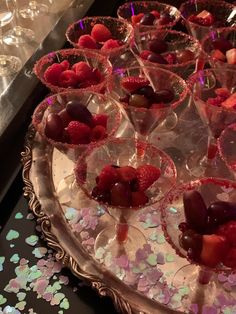 there are many desserts on the tray ready to be served at this party or wedding reception