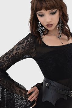 ROSEDRIAH BODYSUIT.- Statement custom lace.- Long bell sleeves.- Square neckline.- Keyhole button closure.- Lined popper gusset.- Fitted.With KILLSTAR branding, Lace: 88% Polyamide 12% Elastane, Lining: 95% Polyester 5% Elastane.Hand wash delicate 30°c / Do not bleach / Do not tumble dry / Iron at low temperature / Do not dry clean. Imported. Fitted Lace Top Bodysuit For Party, Gothic Party Tops With Sheer Sleeves, Gothic Stretch Bodysuit For Night Out, Lace Bodysuit For Evening, Fitted Black Gothic Lace Top, Fitted Black Lace Top With Lace Cuffs, Gothic Party Tops With Lace Sleeves, Gothic Bodysuit For Night Out, Fitted Gothic Top With Sheer Sleeves