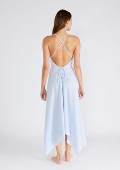 Freshen up your warm-weather wardrobe with our versatile halter neck beach dress in a breathable cotton gauze fabrication. This show-stopping style features a plunging v-neckline and a handkerchief hemline. The long straps can be tied in multiple ways, making it the most versatile dress in your closet. Airy cotton gauze Sleeveless Maxi length Handkerchief hemline V-neckline Halter neck Open back Cross back detail Long straps can be tied in multiple ways Model is 5'9, wearing a size S/M.Style: I- Summer Flowy V-neck Halter Dress, Breezy V-neck Beach Dress For Daywear, Chic V-neck Beach Dress With Tie Back, Spring V-neck Halter Dress With Crisscross Straps, Breezy V-neck Sundress For Daywear, Airy Summer Maxi Dress For Vacation, Summer Vacation Maxi Dress With Crisscross Straps, Summer Maxi Dress With Crisscross Straps For Vacation, Airy Maxi Dress For Summer Vacation