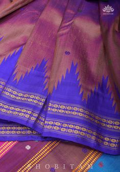 An exquisite handloom saree from Orrisa, this particular saree prides itself with the resplendent double pallu set in striking colors and iconic phoda kumbha or temple borders in two different colors! The body has dainty buttas while the border has woven motifs.This saree is completely handwoven using the Ikkat technique of dye and weave! Set on pure Berhumpuri silk, on a pleasing shade, the fabric is light and easy to drape!SILK MARK CERTIFIEDThe saree is ready to wear with falls and pico done. Pure Silk Saree, Purple Silk, Pure Silk Sarees, Handloom Saree, Free Giveaway, Pure Silk, Silk Saree, Blouse Designs, Silk Sarees