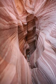 an instagram photo of a person in the middle of a slot in a canyon