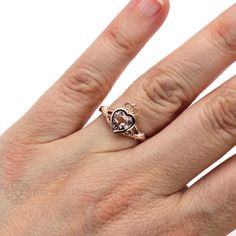 "A symbol of love, friendship and loyalty dating back to the 17th century, the Claddagh ring is a beloved tradition in Ireland. It's been re-created here in this updated contemporary celtic design, with a beautiful natural peachy pink Morganite at the heart. It's available in your choice of 14K or 18K White, Yellow or Rose Gold or Platinum. Made to order. Please allow four to six weeks for delivery. Inquire for the matching wedding band. ABOUT THIS RING Shown on Ring Size 7 Hand Engagement Shank Heirloom Jewelry With Rose Cut Heart Diamonds, Promise Jewelry With Heart-shaped Rose Cut Diamonds, Heirloom Style Valentine's Day Jewelry Ring, Valentine's Day Heirloom Ring Jewelry, Valentine's Day Heirloom Ring, Heirloom 14k Rose Gold Jewelry With Rose Cut Diamonds, 14k Gold Heart Cut Rose Diamonds Jewelry, 14k Gold Heart Cut Jewelry With Center Stone, Symbolic Rose Gold Promise Jewelry