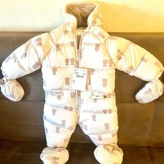 Unisex Snowsuit By Mayoral, With Teddy Bear Pattern. Thickly Padded And Has A Fixed Hood With Faux Fur Trim. It Has A Front Zip Fastening And A Soft Jersey Lining. The Mittens And Booties Are Removable And Secure With Buttons To The Elasticated Cuffs. Red Puffer Jacket, Girls Puffer Jacket, Baby Snowsuit, Winter Fur Coats, Red Puffer, Quilted Puffer Jacket, Teddy Bear Pattern, Baby Jacket, Kids Coats