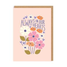 a pink card with flowers and the words, always in our hearts on it's front