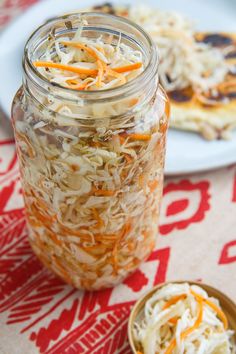 a jar filled with food sitting on top of a table