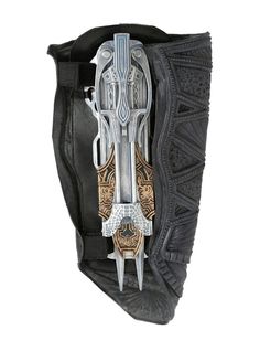 the back side of a black and gold case with two knives in it's pouch