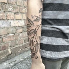 a person with a tattoo on their arm