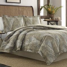 the comforter is made up with palm leaves