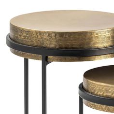 two round tables with gold and black accents