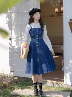 A dark wash denim dress with braided cami straps, button down front and A-line midi skirt. Back is slightly stretchy. S: 30"-34" chest, 26" waist, 42" lengthM: 31.5"-35.5" chest, 27" waist, 42" lengthL: 33"-37" chest, 28" waist, 42" length Blue Denim Skirt Outfit, Denim Dress Outfit Winter, Shirt Under Dress, Dress With Jeans, Blue Skirt Outfits, Denim Dress Outfit, Dress Over Jeans, Bright Colored Outfits, Jean Skirt Outfits