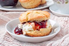 two scones filled with ice cream and jelly