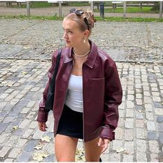 Take your casual wardrobe to the next level with our Retro Revival Chic Bomber. This timelessly stylish jacket blends vintage charm with contemporary design, featuring a turn-down collar, solid pattern, full sleeves, and regular fit for comfort and versatility. Thoughtfully placed zippers add a touch of elegance, while the high-quality polyester ensures long-lasting luxury. Elevate your wardrobe with Retro Revival Chic Bomber. Designed by Thekittenpark Cherry Red Jacket, Short Leather Jacket, Cropped Coat, Pu Leather Jacket, Patchwork Jacket, Long Sleeves Coats, Zipper Jacket