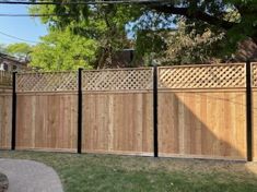 a wooden fence in front of a house