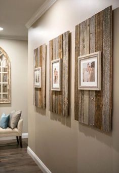 an image of some pictures hanging on the wall in a room with wood paneling