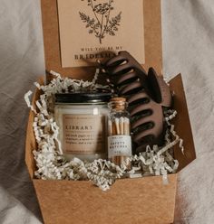 Say Will you be my bridesmaid? in style with this dark academia bridesmaid proposal gift box! Show your favorite bookish friends how much you appreciate their help with this thoughtful combo, featuring one Grace + Bloom literary-themed candle for them to light while they read, a decorative glass bottle of white-tipped matches, a cute claw clip to keep their hair back, and a custom-designed Will you be my... card that doubles as a bookmark Personal Attendant, Fall Bonfire, Literary Candles, Match Bottle, Shop Inspiration, Spiced Cider, Candle Matches, Glass Bottles Decoration, Cadeau Diy