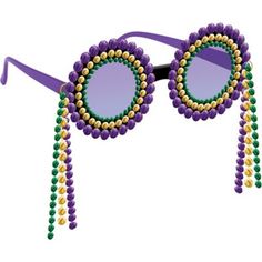 a pair of sunglasses with beaded decorations on the side and purple tinted lenses