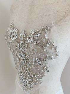 Rhinestone bead applique, crystal bodice patch, heavy bead handmade SIZE: 26cm at the widest point 25cm in height in central This stunning rhinestone applique is hand crafted, design with elegant florals. There is no iron on glue on the back, sew it to your dress . Suitable for bridal dress, evening dress and haute couture for special events, highly recommended for bridals and designers. SUPER LUXURY, HIGHLY RECOMMENDED! SIMILAR ITEMS: https://www.etsy.com/listing/1143786315/pale-blue-french-bea Wedding Corset With Sequins And Fitted Bodice, Glamorous Embellished Wedding Dress With Sweetheart Neckline, Glamorous Embellished Wedding Corset, Elegant Embellished Wedding Corset, Fitted Sequin Wedding Corset, Glamorous Sequined Corset For Wedding, Wedding Corset With Embellished Fitted Bodice, Wedding Fitted Sequin Corset, Wedding Corset With Embellished Sweetheart Neckline