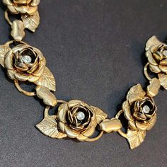 You never know what unique and unusual treasures you will find when you visit my shop! Inventory changes daily to weekly. Vintage Rose Choker, Rhinestone Choker, Flower 16 Inch Choker Box Clasp This would make a great "something old" for a wedding ceremony! The gold on the chain is a little bit faded. The roses and rhinestones are in good condition. Ships from California. == SHIPPING == Ships from California. Most orders ship within 1-3 business days. Orders from my shop totaling $35 and over qu Metal Rose Design Jewelry For Wedding, Wedding Jewelry With Rose Design In Metal, Vintage Rose Jewelry For Anniversary, Vintage Rose-colored Jewelry For Anniversary, Vintage Flower Shaped Jewelry For Party, Vintage Flower Jewelry For Party, Vintage Rose-colored Jewelry For Weddings, Vintage Metal Jewelry With Rose Design, Vintage Rose Design Jewelry For Formal Occasions