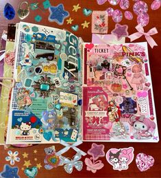 an open book filled with lots of stickers and magnets on top of a wooden table