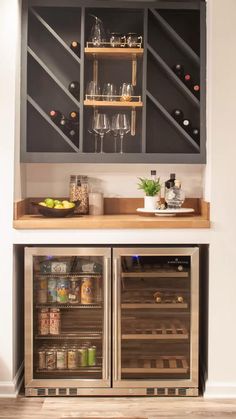 an open refrigerator with two wine glasses on it