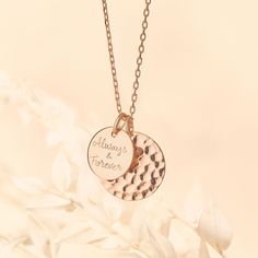 Our Personalized Hammered Double Disc Necklace suits any style and occasion, hand-engraved with special names, dates or messages.18K Champagne Gold Plated, 925 Sterling Silver or 18K Rose Gold PlatedHammered disc charm: 0.8”x0.8”, smooth disc charm: 0.6”x0.6”Charms are removable from this chain and can be worn on all Merci Maman chain lengthsEngrave up to 20 charactersEngraving on smooth charm onlyHand-engraved in our Paris workshopSent with love in a complimentary gift boxAny slight variations Hammered Medallion Jewelry For Anniversary, Anniversary Charm Necklace With Coin Pendant, Anniversary Coin Pendant Charm Necklaces, Engraved Rose Gold Jewelry For Personalized Gift, Personalized Engraved Rose Gold Jewelry, Personalized Rose Gold Jewelry With Engraving Option, Engraved Disc Jewelry For Mother's Day, Engraved Round Disc Jewelry For Mother's Day, Mother's Day Engraved Round Disc Jewelry