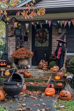 a house decorated for halloween with pumpkins and decorations