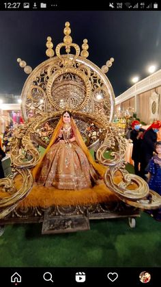 an elaborately decorated chair is on display in a room with people standing around it