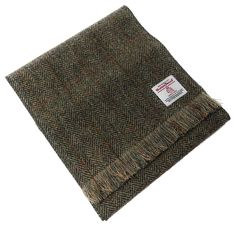 Wrap yourself in the timeless elegance of our Harris Tweed Green Herringbone Scarf. Handmade from 100% pure wool.This scarf embodies the rich heritage of Scottish craftsmanship and is perfect for adding a touch of elegance to your wardrobe. Fringed at each end with narrow overlock stitching along the sides, it's a stylish and durable accessory suitable for any occasion. Features: 100% Pure Wool: Crafted from authentic Harris Tweed, known for its exceptional quality and durability. Handwoven in S Tweed Accessories, Tweed Scarf, Women Baseball Cap, Harris Tweed Fabric, Baker Boy Hat, Outer Hebrides, Herringbone Design, Baseball Women, Unique Nature