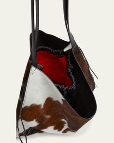 Christian Louboutin "Le 54" tote bag in leather and cow printed natural/dyed calf hair (Italy)    Shoulder straps     Open top with drawstring closure     Exterior, side CL logo hardware     Interior, one zip pocket     Signature red lining     Approx. 15.4"H x 19.7"W x 2.8"D    Made in Italy Calf Leather Tote Bucket Bag For Travel, Calf Leather Bucket Bag With Handle Drop For Travel, Luxury Rectangular Calf Hair Bag, Travel Bucket Bag With Handle Drop In Calf Leather, Black Calf Hair Bag With Leather Handles, Luxury Calf Hair Shoulder Bag For Daily Use, Rectangular Calf Hair Bag For Shopping, Calf Hair Rectangular Shopping Bag, Luxury Shoulder Bag With Leather Handles And Calf Hair