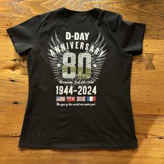 Our newest design recognizes this year's 80th anniversary of D-Day. Over the left chest, "D-Day 80," the flags of the major allied nations involved in the landing, and the years 1944 - 2024. On the back: 80 with a photo of from the D-Day Landing Normandy and the date of the landing, June 6th 1944 The flags of the major allied nations involved in the landing, including the Red Ensign for Canadian troops and the 48-star flag for US troops. The years 1944 - 2024 Text from Gen. Dwight D. Eisenhower'