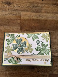 a card with shamrocks on it that says happy st patrick's day in gold and green