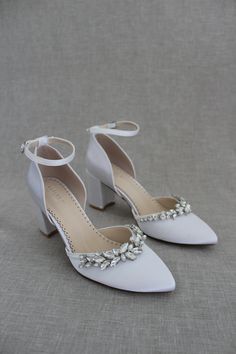 Classic and elegant satin almond toe block heels with added marquise rhinestones are the perfect shoes for weddings, parties or any special occasionDETAILS:HEEL HEIGHT: 2.75 inchesCOLORS AVAILABLE: Champagne, White, Ivory, Navy, Burgundy, and Light BlueUPPER: Synthetic upper and liningMATERIALS: Mandmade outsoleSTYLE NAME: SALLY Crystal Ankle Strap Heels For Wedding, Wedding Crystal Heels With Ankle Strap, Embellished Block Heel Wedding Shoes For Prom, Embellished Wedding Shoes For Prom With Block Heel, Satin Heels With Rhinestones For Wedding, Crystal High Heels For Wedding, Crystal Embellished Wedding Heels, Satin Closed-toe Wedding Shoes, Satin Heels With Rhinestones And Pointed Toe