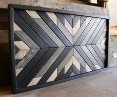 a wood paneled wall with black and white designs on it