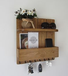 a wooden shelf with keys, sunglasses, and other items on the shelves above it