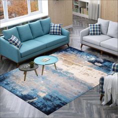 a living room filled with furniture and a blue rug