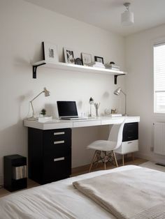 a white and black desk in a bedroom