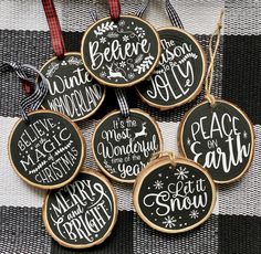 christmas ornaments with chalkboard sayings on them