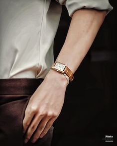 a close up of a person wearing a watch