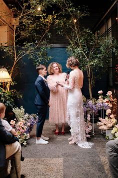 the bride and groom are exchanging vows at their wedding ceremony