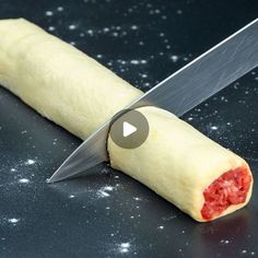 a piece of food with a knife sticking out of it